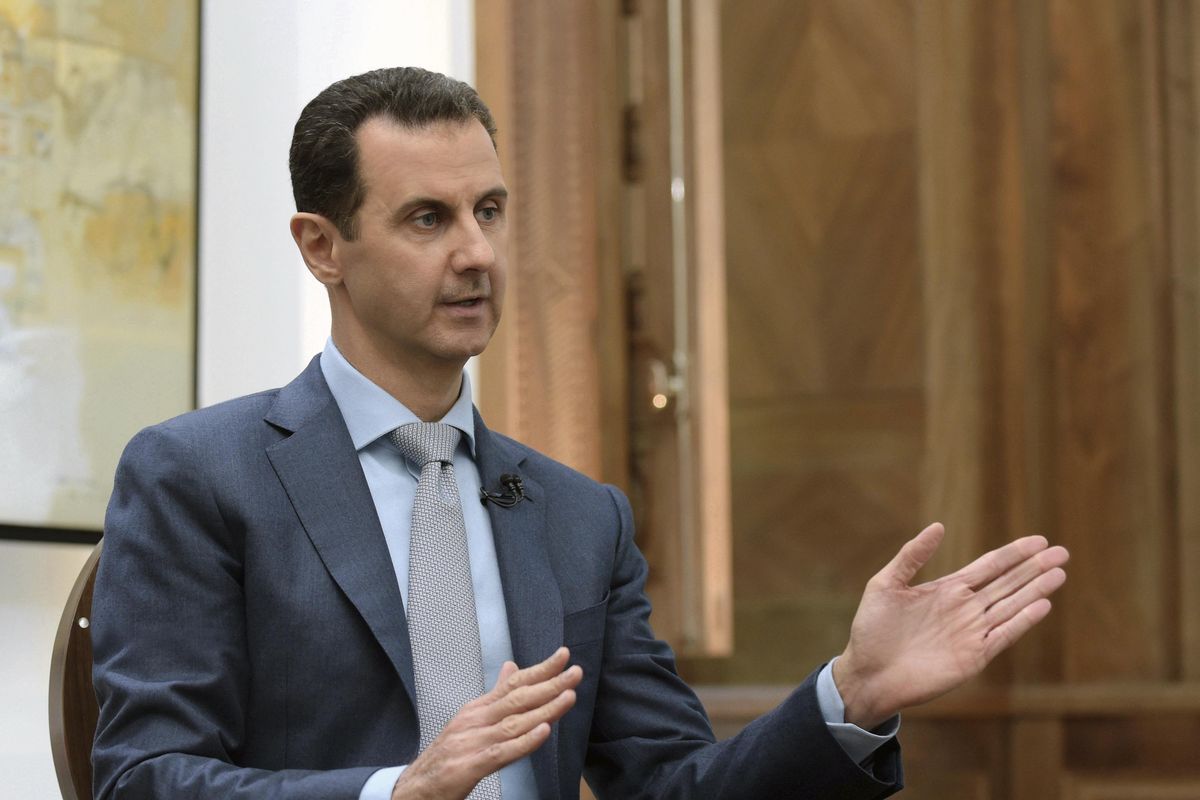 In this photo released by the Syrian official news agency SANA, Syrian President Bashar Assad speaks during an interview with Yahoo News in Damascus, Syria, Friday, Feb. 10, 2017. (Uncredited / Associated Press)