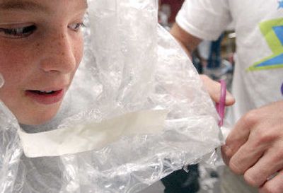
Mitch Shellman, 11, and David Freet, 10, below, prepare for a storm on Planet Zak during Camp Invention at Fernan Elementary on Tuesday. 
 (Kathy Plonka photos/ / The Spokesman-Review)