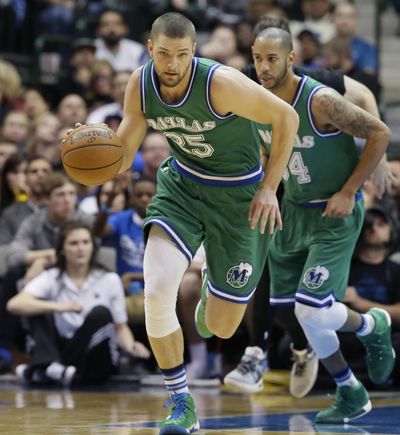 A person with knowledge of the situation says Dallas Mavericks forward Chandler Parsons, center, will have arthroscopic surgery for a meniscus tear in his right knee but might not be finished for the season. (LM Otero / Associated Press)