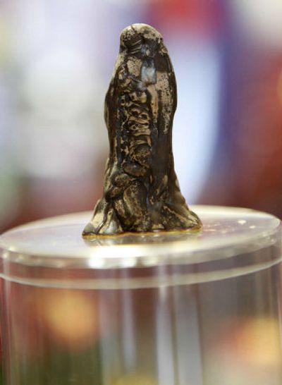 
A piece of chocolate, which some believe resembles the Virgin Mary, is seen at Bodega Chocolates.
 (Associated Press / The Spokesman-Review)