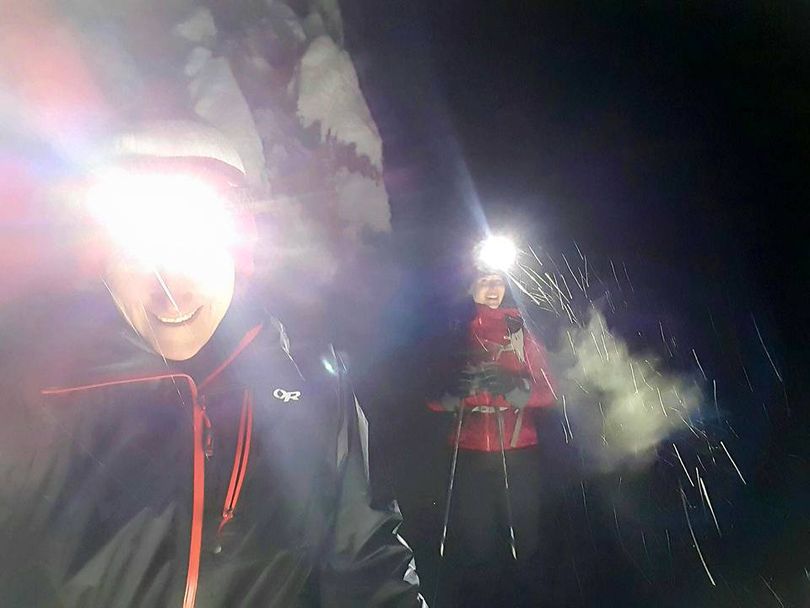 Sue Niezgoda and Elizabeth Earp pause in the precipitation of a night ski on the cross-country trails at Mount Spokane. (Sue Niezgoda)