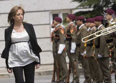 
Carme Chacon, Spain's first female defense minister,  reviews troops in Madrid on Monday. Associated Press
 (Associated Press / The Spokesman-Review)