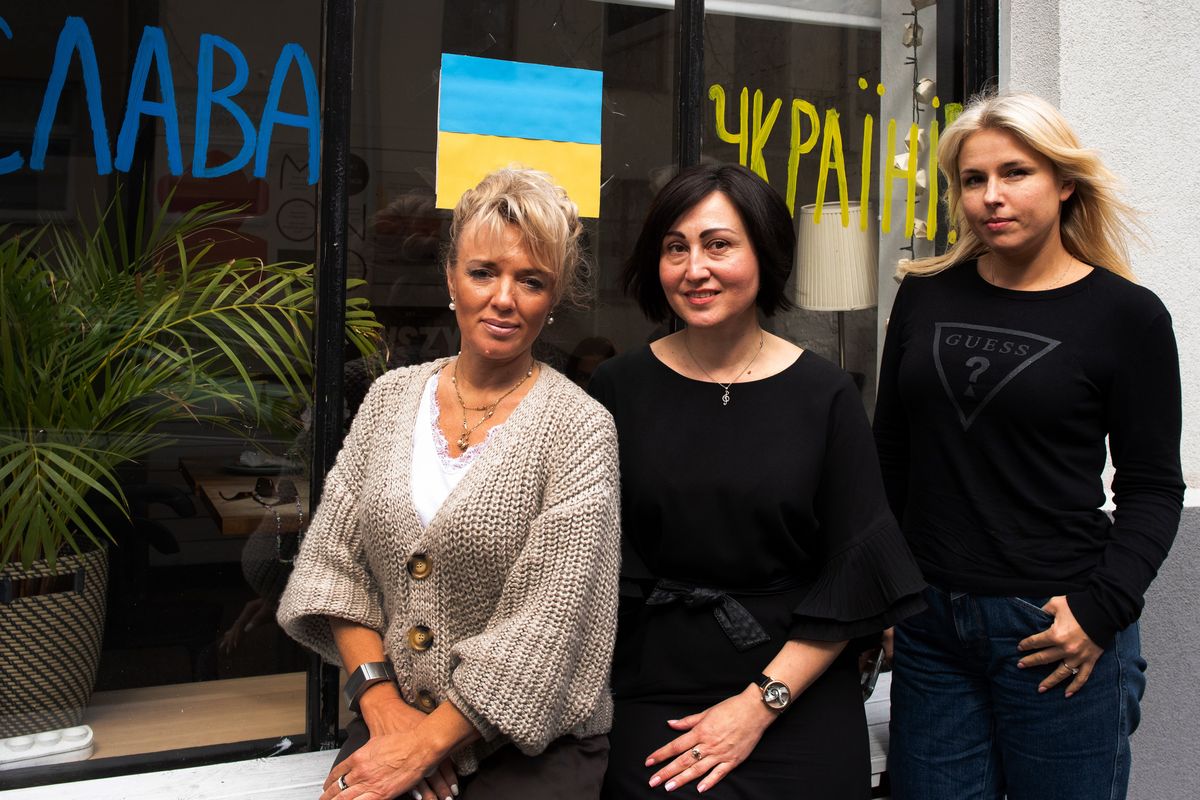 Helena Gladkaya, left, Natalia Voloshko and Oleska Kovalovic stand for a photo on Monday in Warsaw, Poland. All three women fled the war in Ukraine.  (Eli Francovich/The Spokesman-Review)