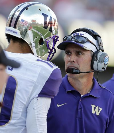 Coach Chris Petersen’s Huskies could be on their way to a significant bowl game. (Rick Scuteri / Associated Press)