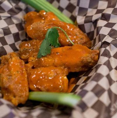 Chicken wings, like these from the Ref Sports Bar, are among the most-ordered items during winning Zags games, according to data from Grubhub. (Tyler Tjomsland / The Spokesman-Review)