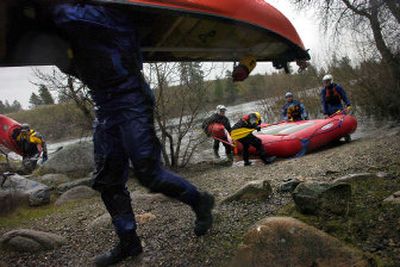 
Kayakers, canoeists and rafters take their crafts out of the Spokane River at Mirabeau Point on Wednesday. 
 (Jed Conklin photos / The Spokesman-Review)