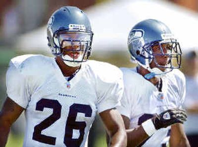 
Ken Hamlin, left, and Marcus Trufant enter their second seasons and will be counted on to anchor Seattle's secondary. 
 (Associated Press / The Spokesman-Review)