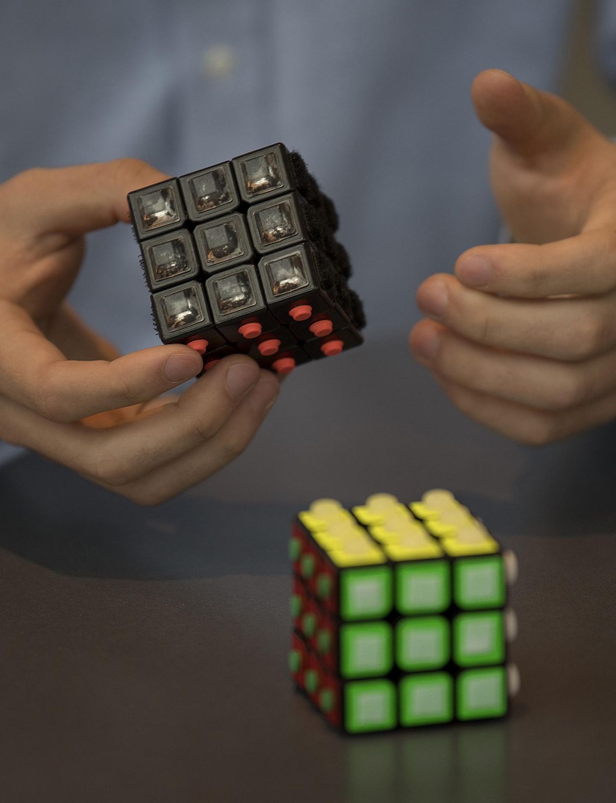 In this Dec. 19, 2017 photo, Carson Mowrer, 17, describes how the textile Rubik