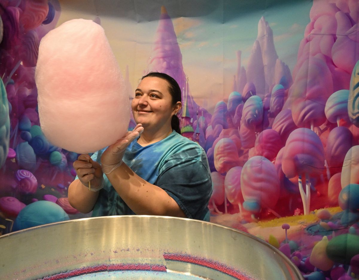 Jacey Dowis, owner of Spokane Sugar Candy, a cotton candy shop inside the Blissful Whisk coffee shop and bakery at 1612 N. Barker Road, begins building one of her fanciful cotton candy designs in her shop, shown Thursday in Spokane Valley.  (Jesse Tinsley/THE SPOKESMAN-REVIEW)