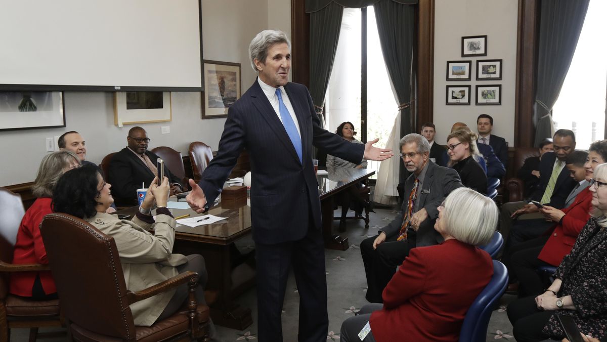 Former U.S. Secretary of State John Kerry greets members of the House Democratic Caucus, Tuesday, Feb. 13, 2018, during a visit hosted by Gov. Jay Inslee to participate in meetings discussing the governor