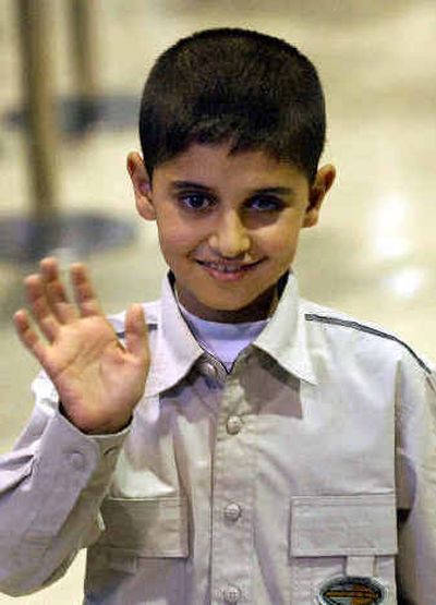 Mohamad Haytham Saleh, 10, waves on his arrival at New Tokyo International Airport this morning.Mohamad Haytham Saleh, 10, waves on his arrival at New Tokyo International Airport this morning.
(Associated PressAssociated Press / The Spokesman-Review)