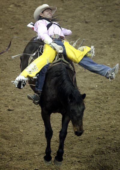 Bobby Mote ties the National Finals Rodeo bareback record aboard Spring Fling, from Big Bend Rodeo in Ritzville.  (Associated Press / The Spokesman-Review)