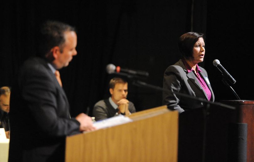 pokane Mayor David Condon, left, debates his opponent, Shar Lichty, right, at the candidate debates held by the Chase Youth Commission Wednesday, Oct. 7, 2015 at North Central High School. (Jesse Tinsley / The Spokesman-Review)