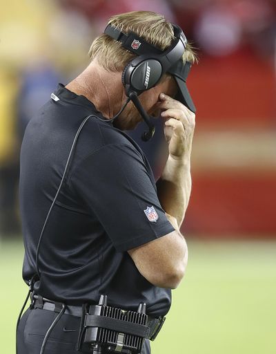 Oakland Raiders coach Jon Gruden covers his face on the sideline during the second half of the team’s NFL game against the San Francisco 49ers in Santa Clara, Calif., Thursday, Nov. 1, 2018. (Ben Margot / Associated Press)