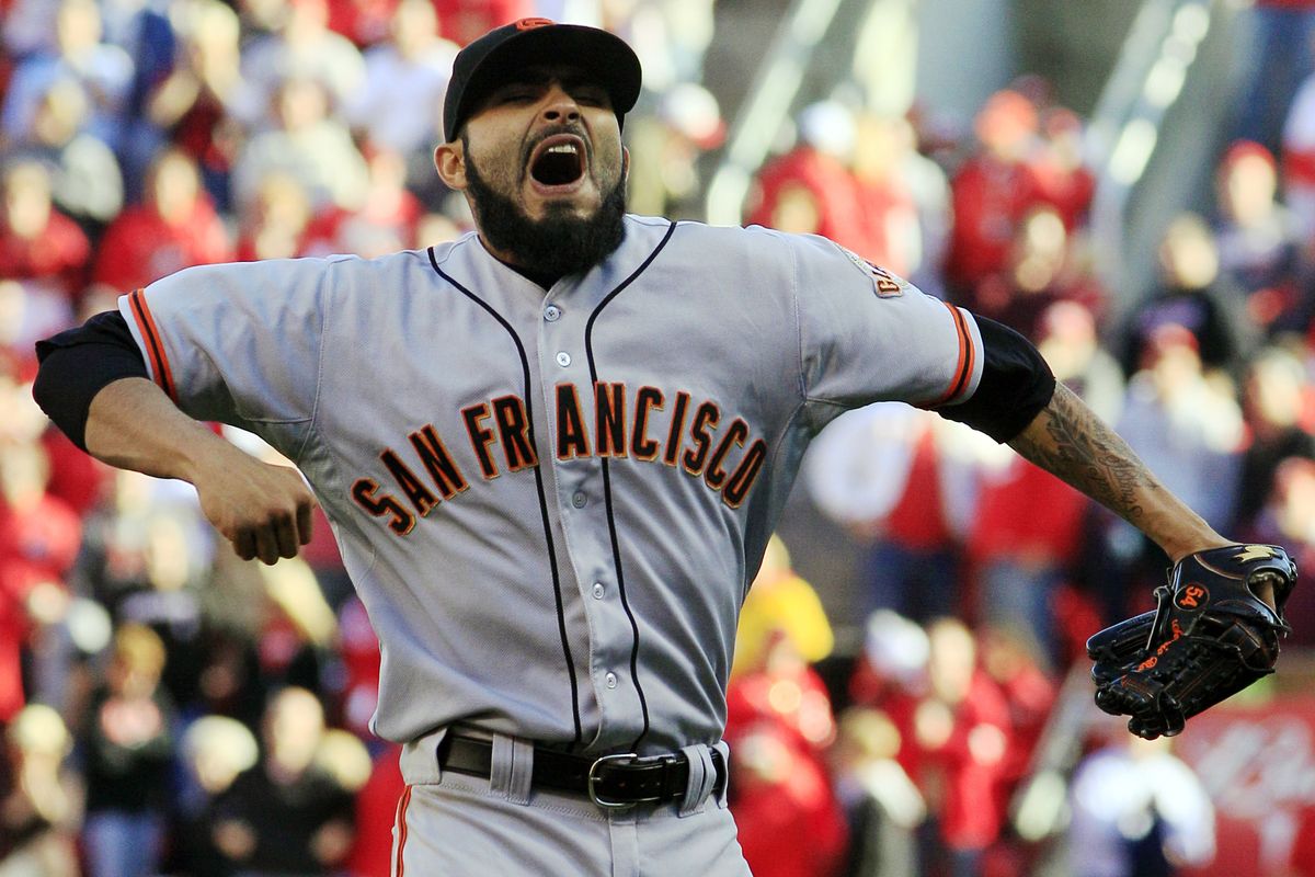 Relief pitcher Sergio Romo celebrates after the Giants defeated the Reds on Thursday to advance to the NLCS. (Associated Press)