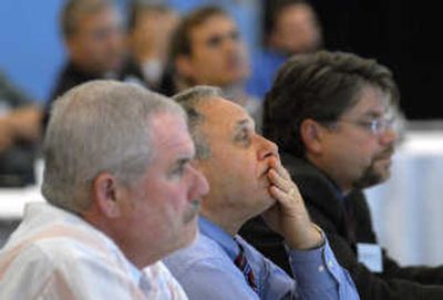 
Bonner County commissioners Lewis Rich, left,  and Todd Crossett, right,  and Kootenai County Commissioner Rich Piazza, center, listen to a report on the cross-state aquifer study. 
 (Jesse Tinsley / The Spokesman-Review)