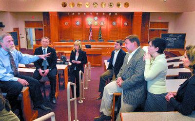 
Jeffry Finer, left, talks with plaintiffs and their attorneys Thursday at the Gonzaga Law School. From right, plaintiff Natayla Prach and Natayla Kriger with her husband, plaintiff Ivan Kriger, attorneys Leigh Talley, Jennifer Hendrickson and Christopher Berhow were involved with the case. 
 (Jed Conklin / The Spokesman-Review)