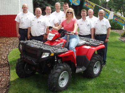 
Pictured, left to right: Darrell Herron, South Hill; Curtis Graham, Francis; David McCallister, N.W. Blvd.; Rich Reiman, Cheney; Matt Ratchen, U-City; the lucky winner, Deborah Austin; Rick Woods, Downtown; Dennis Wallingford, North Division; Scott Burgess, Veradale.
 (The Spokesman-Review)