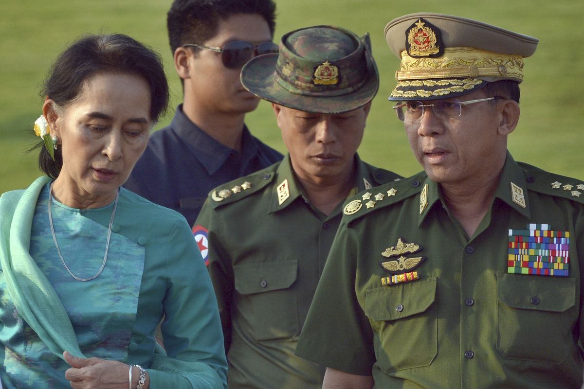 FILE - In this May 6, 2016, file photo, Aung San Suu Kyi, left, Myanmar
