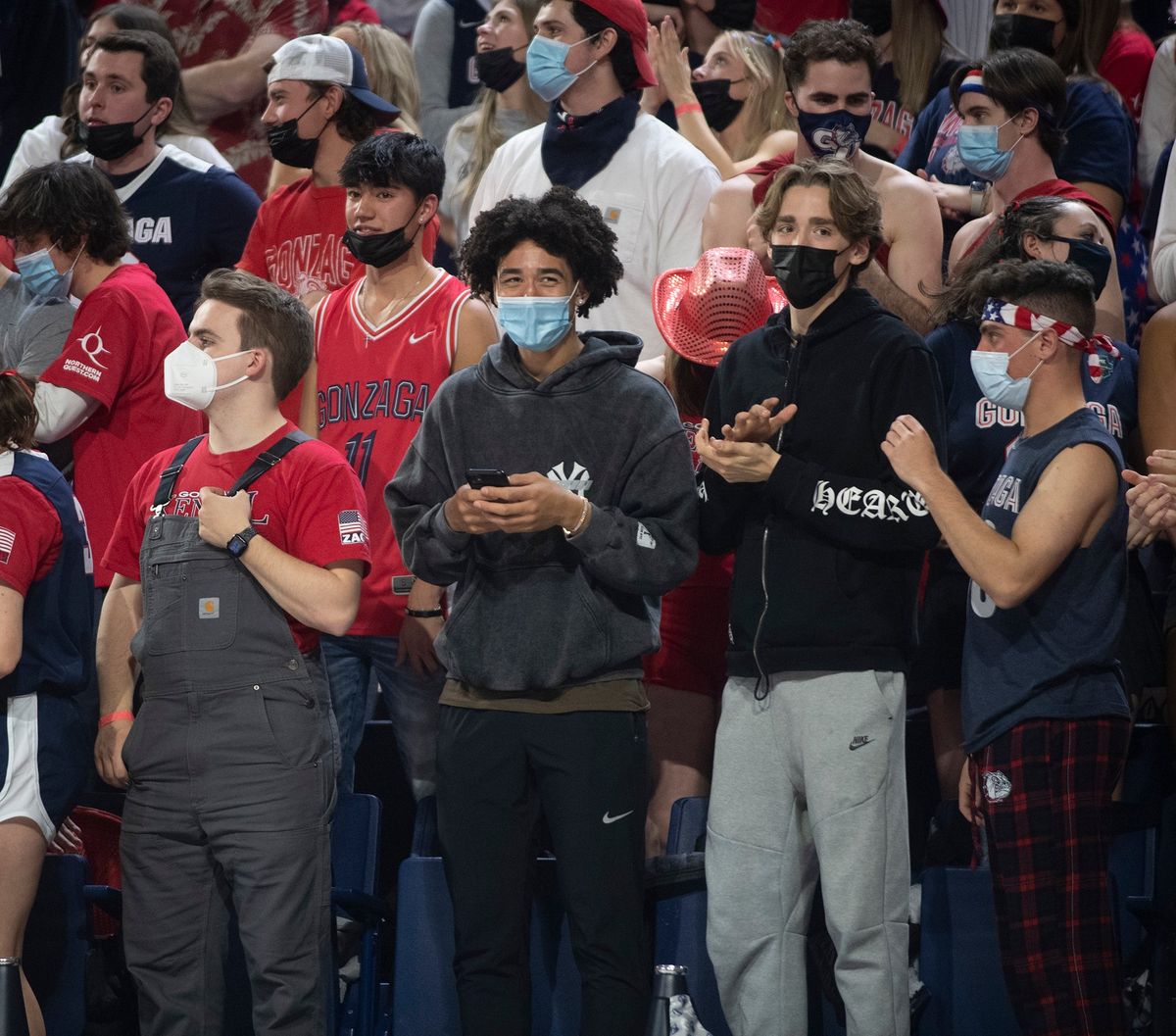 Two prospective Zag recruits, Jared McCain, center left, (in Yankees sweatshirt) and Dusty Stromer, right, watch the Zags beat St. Mary