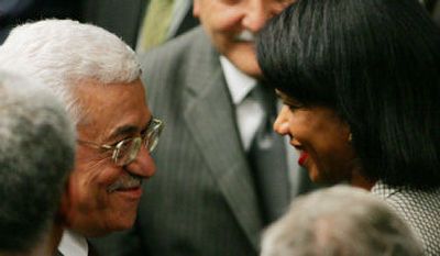 
Palestinian President Mahmoud Abbas talks with U.S. Secretary of State Condoleezza Rice after a U.N. Security Council meeting. 
 (Associated Press / The Spokesman-Review)