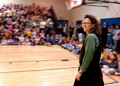 
Teacher Laura Dougall walks past the student body to accept her award during a ceremony to recognize Dougall with a School Champion Award Tuesday at Prairie View Elementary in Post Falls. 
 (Jesse Tinsley / The Spokesman-Review)