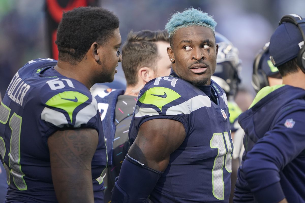 Seattle wide receiver DK Metcalf talks with center Kyle Fuller during a game against Jacksonville on Oct. 31 in Seattle.  (Ted S. Warren)