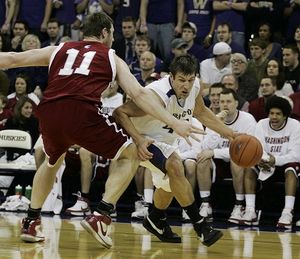 Washington forward Jon Brockman, right, drives around Washington State center Aron Baynes in the first half of a college basketball game Saturday, Jan. 5, 2008, at Hec Edmondson Pavilion in Seattle. (AP Photo/Ted S. Warren) ORG XMIT: SEA204 (Ted Warren / The Spokesman-Review)