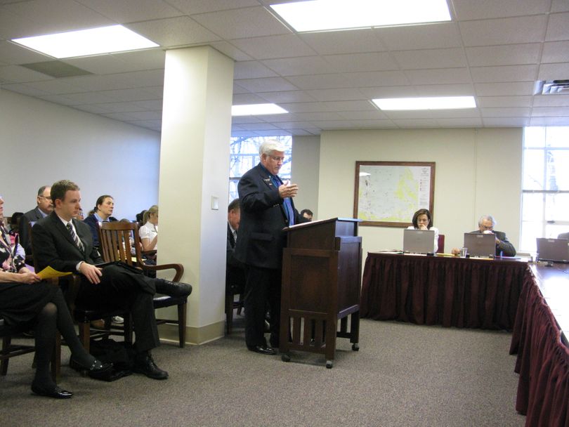 Rep. Dick Harwood, R-St. Maries, presents his sovereignty resolution to the Senate State Affairs Committee, saying the federal government shouldn't entice the state with federal money. The panel approved the measure, plus another just after it that asked the federal government to send Idaho money to offer a medical degree. (Betsy Russell / The Spokesman-Review)