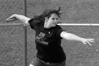 
Kristine Leonard of Lakeland spins to throw the discus, setting a personal best of 119-9 Friday. 
 (JESSE TINSLEY The Spokesman-Revi / The Spokesman-Review)