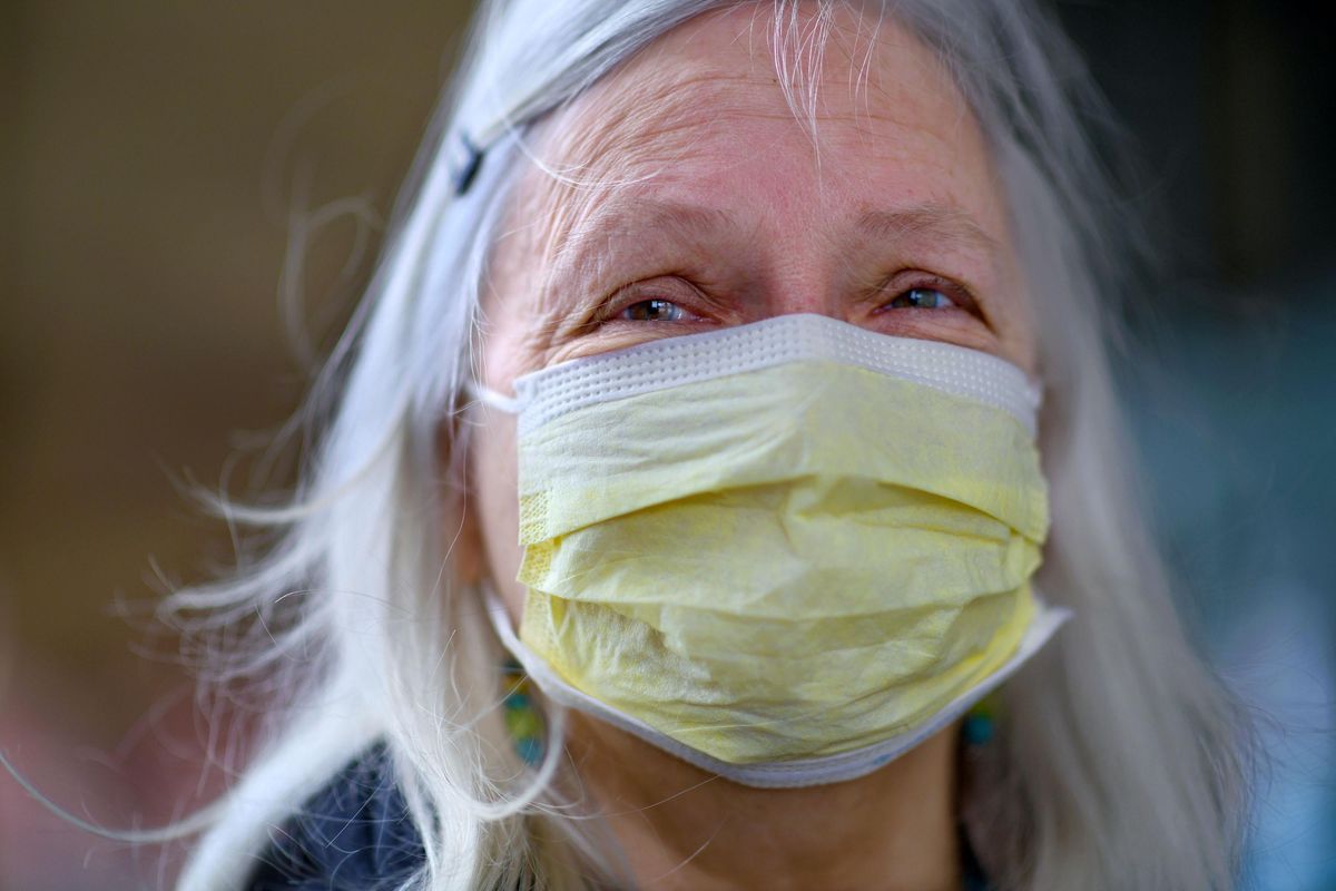 "I'm 63 and have fibromyalgia," says Frieda Berkenbile about wearing a mask to protect herself from COVID-19 near her home home in Liberty Lake on Friday, April 3, 2020. (Kathy Plonka / The Spokesman-Review)