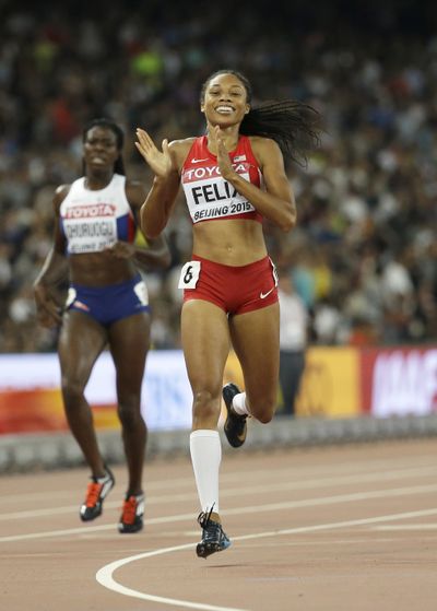 United States' Allyson Felix celebrates after winning the 400m. (Associated Press)