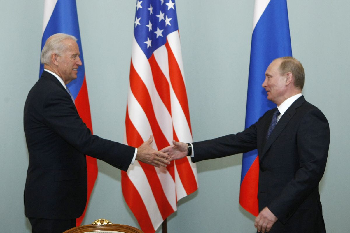 FILE - In this March 10, 2011, file photo, Vice President of the United States Joe Biden, left, shakes hands with Russian Prime Minister Vladimir Putin in Moscow, Russia. Putin won’t congratulate President-elect Joe Biden until legal challenges to the U.S. election are resolved and the result is official, the Kremlin announced Monday, Nov. 9, 2020.  (Alexander Zemlianichenko)