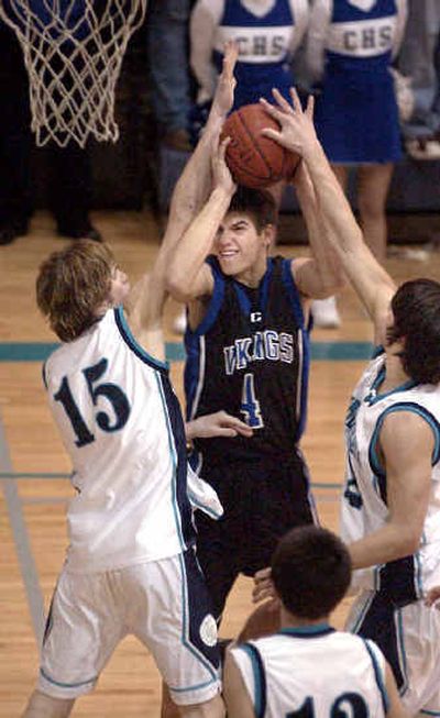 
Coeur d'Alene's Jake Wolfe is stopped by Lake City's Ryan McPhee (15) and Jarom Taylor.
 (Tom Davenport/ / The Spokesman-Review)