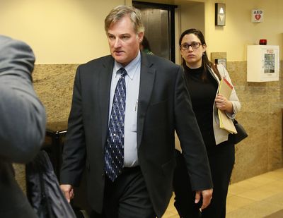 In this Friday, June 30, 2017 photo, Shannon Kepler, left, arrives with his legal team for afternoon testimony in his trial in Tulsa, Okla. Kepler, a former Oklahoma police officer who fatally shot his daughter’s black boyfriend in 2014 is on trial for the third time after jurors in previous trials couldn’t decide whether or not to convict him of first-degree murder. (Sue Ogrocki / Associated Press)