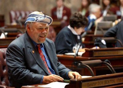 
Sen. Don Benton, R-Vancouver, wears a Seattle Seahawks hat at the start of  Friday's session  of the Senate  in Olympia. Lawmakers were granted a reprieve from their usual strict dress code ahead of the Super Bowl. 
 (Associated Press / The Spokesman-Review)