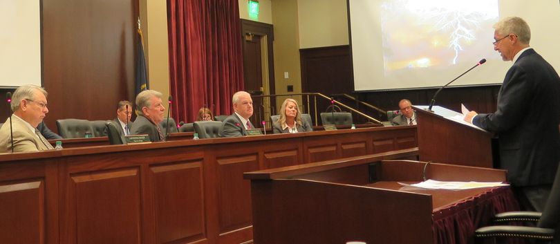 Idaho state forester David Groeschl, right, briefs the state Land Board about this year's fire season, on Tuesday, Sept. 29, 2017. From left are Secretary of State Lawerence Denney, Gov. Butch Otter, state Controller Brandon Woolf; and state Superintendent of Schools Sherri Ybarra. Attorney General Lawrence Wasden participated in the meeting by phone. (Betsy Russell)