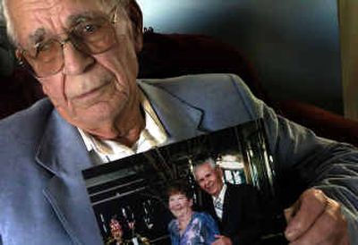 Bill Schmidt holds a picture of him and his wife, Florence, on their 50th anniversary in the Caribbean. Florence died in 2002 from a stroke. Schmidt filed suit against the drug manufacturer of Vioxx, a medication for arthritis that may have caused her death.
(Jed Conklin / The Spokesman-Review)