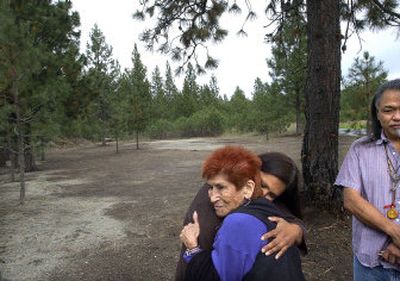 
Confederate Salish and Kootenai elder Marge Stasso is embraced by Flathead member Bonnie Joseph at the All Nations New Beginnings burial grounds at Riverside Memorial Park on Friday after a spiritual dedication. The grounds are set aside for American Indian burials. 
 (Brian Plonka / The Spokesman-Review)