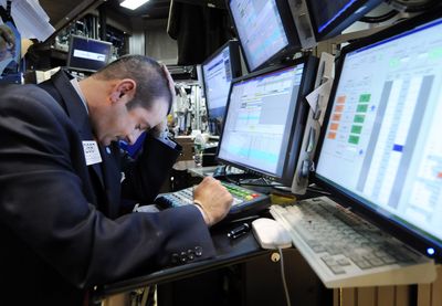 Specialist Michael Sollitto works on the floor of the New York Stock Exchange on Wednesday. (Associated Press / The Spokesman-Review)