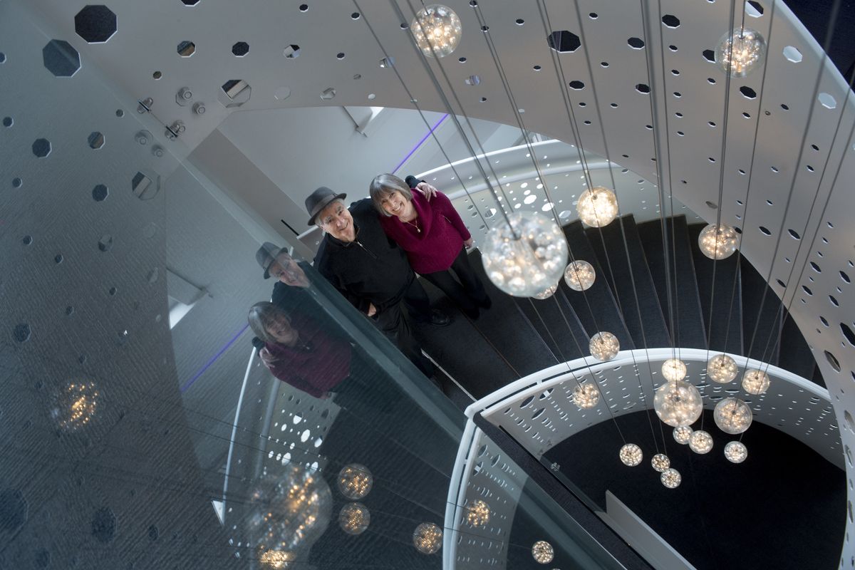 Jerry and Patty Dicker stand on the Bing Crosby Theater’s spiral staircase on Nov. 20. Jerry added the staircase during major renovations for the downtown theater. Before its addition, two upper levels of the theater were inaccessible from the lobby. (Tyler Tjomsland)