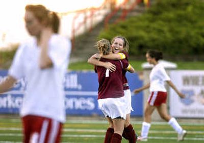 
University  midfielder Abby Goss, right, gets a hug from Katy Sloyer after Goss' game-winning goal. 
 (Jed Conklin / The Spokesman-Review)