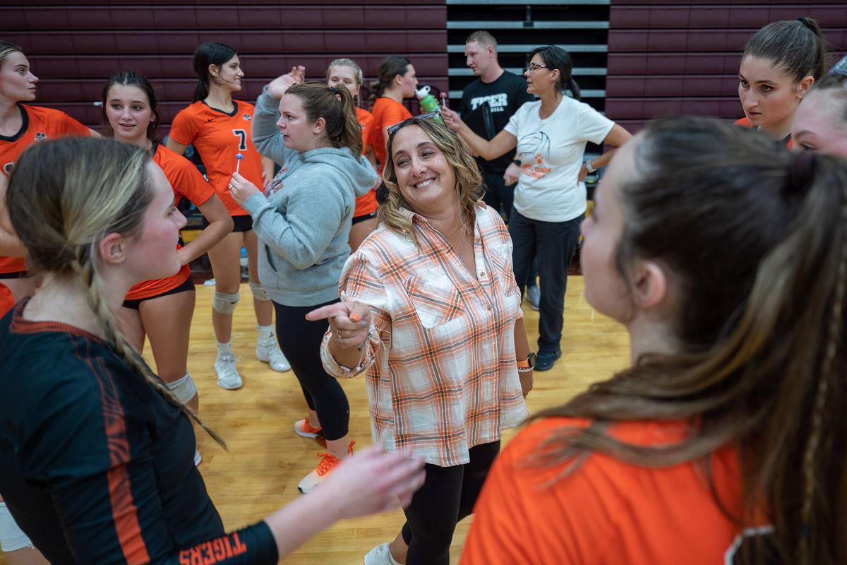 Lewis and Clark volleyball coach Larissa Welch talks with players during a timeout Tuesday during a match at University High School.  (COLIN MULVANY/THE SPOKESMAN-REVIEW)
