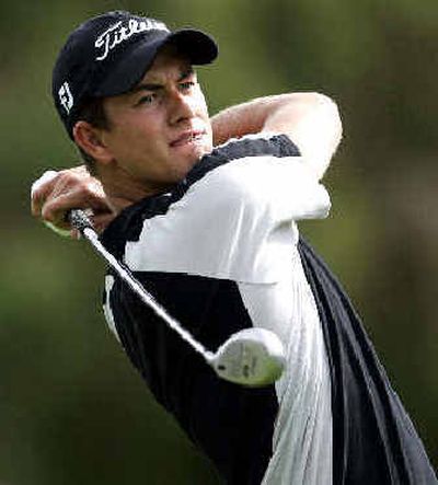 
Australia's Adam Scott drives in the rain during the second round of the Nissan Open on Sunday. 
 (Associated Press / The Spokesman-Review)