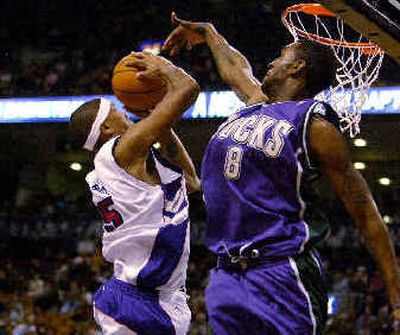 
Milwaukee's Joe Smith, right, defends against Toronto's Jalen Rose.
 (Associated Press / The Spokesman-Review)