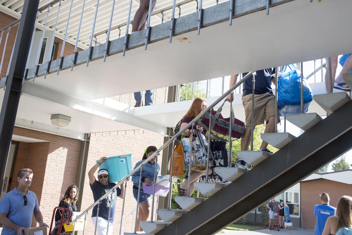 In a steady ant-like procession of incoming freshman, their families and friends, new students at Gonzaga University move into the St. Catherine and St. Monica dormitory complex, Friday, Aug. 25, 2017, which is freshman move-in day. (Jesse Tinsley / The Spokesman-Review)