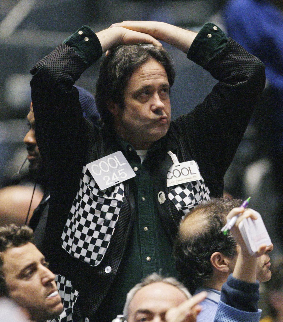 Trader Brain P. Cooley reacts in the Standard & Poor’s 500 futures pit near the close of trading at the CME Group in Chicago on Monday. The S&P 500 index dipped below 700 Monday before closing just above it.  (Associated Press / The Spokesman-Review)