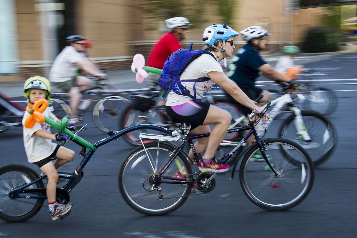 Bicyclists start their ride along Spokane Falls Boulevard during SpokeFest in downtown Spokane Sunday. Riders had the option of a 1-, 9-, 21- or 50-mile course.