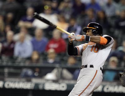 Adam Jones hits a two-run home run in the top of the 11th inning to give Orioles their margin of victory. (Associated Press)