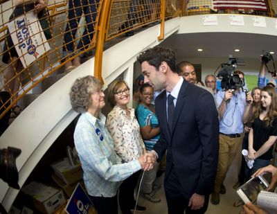 Democratic candidate for Georgia's Sixth Congressional seat Jon Ossoff greets supporters at a campaign field office Tuesday, April 18, 2017, in Marietta. Voters began casting ballots on Tuesday in the special election to fill the House seat vacated by Health and Human Services Secretary Tom Price. (John Bazemore / Associated Press)
